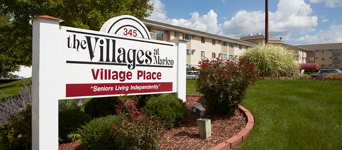 An exterior shot of Village Ridge at Marion's outdoor sign.
